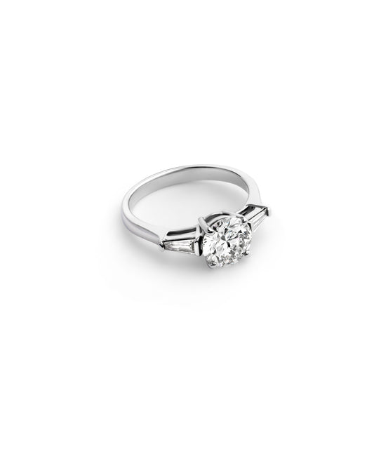 Round Brilliant Diamond with Tapered Baguette Side Stones in White Gold