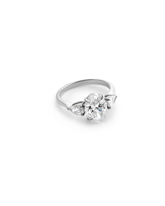 Round Brilliant Diamond with Pear Side Stones in White Gold